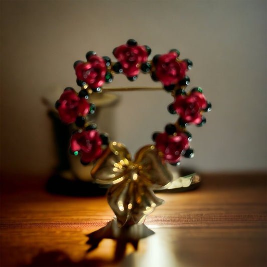 Vintage Avon brooch with red floral wreath and gold bow from 1118 Emporium
