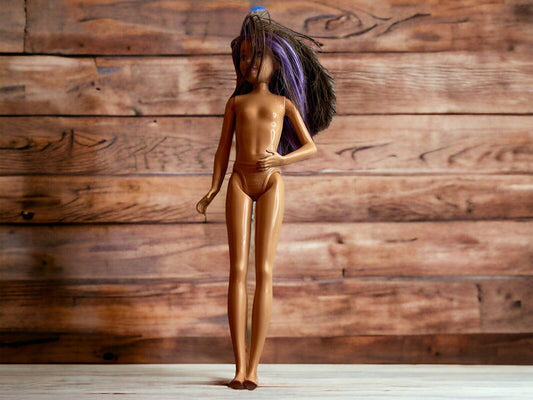 Nude vintage Barbie doll with long dark and purple hair standing on wooden surface vintage Barbie doll for sale
