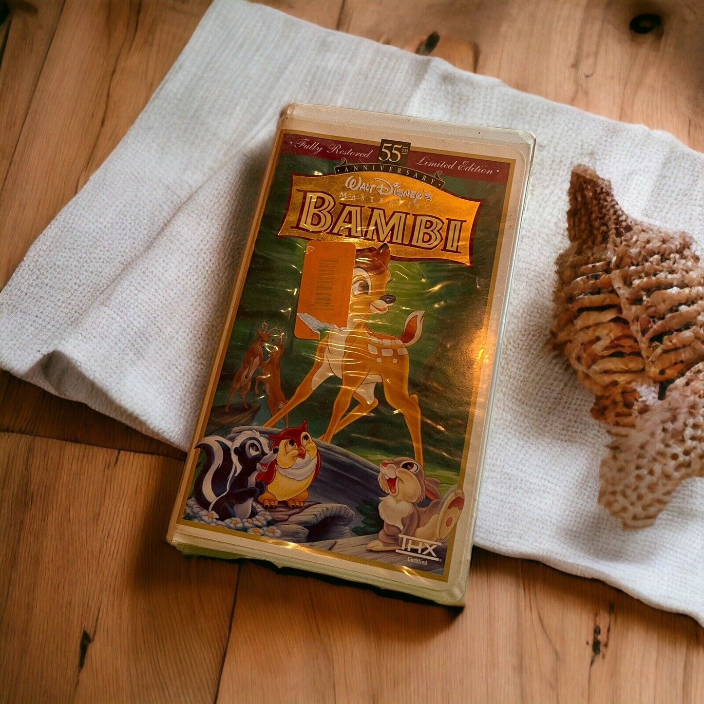 Walt Disney Bambi 55th anniversary VHS limited edition case on white cloth with wooden background
