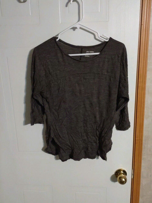1118 Emporium women's casual black blouse with 3 quarter sleeves hanging on white hanger