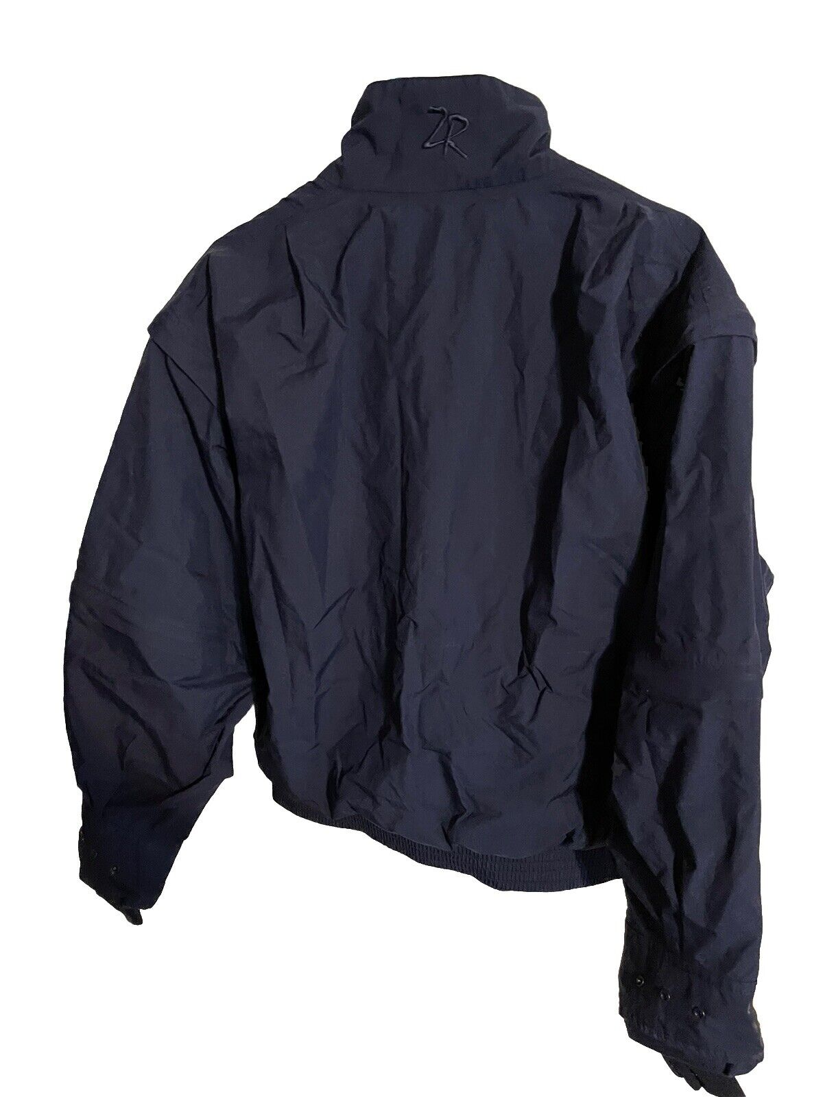 Black zero restriction Gore Tex golf jacket with high collar and long sleeves from 1118 Emporium
